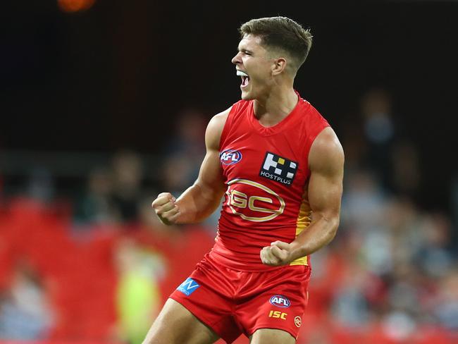 GOLD COAST, AUSTRALIA - FEBRUARY 22: Connor Budarick of the Suns celebrates a goal during the 2020 Marsh Community AFL Series match between the Gold Coast Suns and the Geelong Cats at Metricon Stadium on February 22, 2020 in Gold Coast, Australia. (Photo by Chris Hyde/Getty Images)