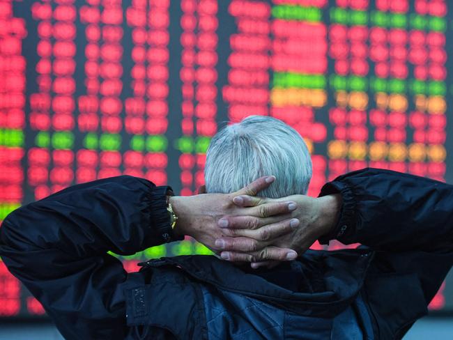 An investor looks at a screen showing stock market movements at a securities company in Hangzhou, in eastern China's Zhejiang province on February 8, 2024. (Photo by AFP) / China Out