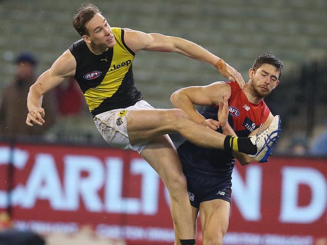 Melbourne’s Kyle Dunkley tries to spoil Richmond’s Tom Lynch. Pic: Michael Klein