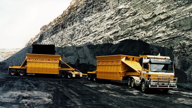 Trucks moving coal.