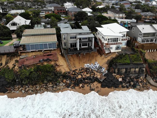 Homes along Ocean View Drive in Wamberal continue to teeter on the edge as high tides threaten to further erode sand and cause the foundations to wash away. Picture: Toby Zerna