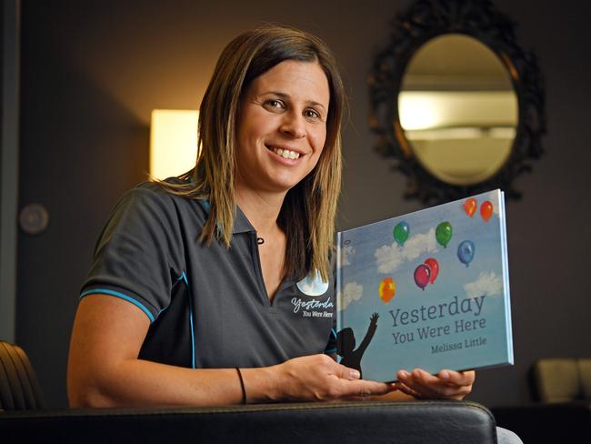 Melissa Little at her book launch with her book. Picture: Tom Huntley