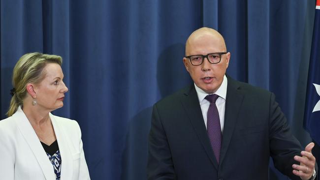 Peter Dutton and Sussan Ley address the media in the opposition party room. Picture: NCA NewsWire / Martin Ollman