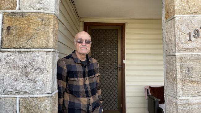 Joel Abouzeid has lived in his Greenacre home for 45 years. A bullet blew through the upstairs window of the home across the street from him last night. Picture: Paul Brescia