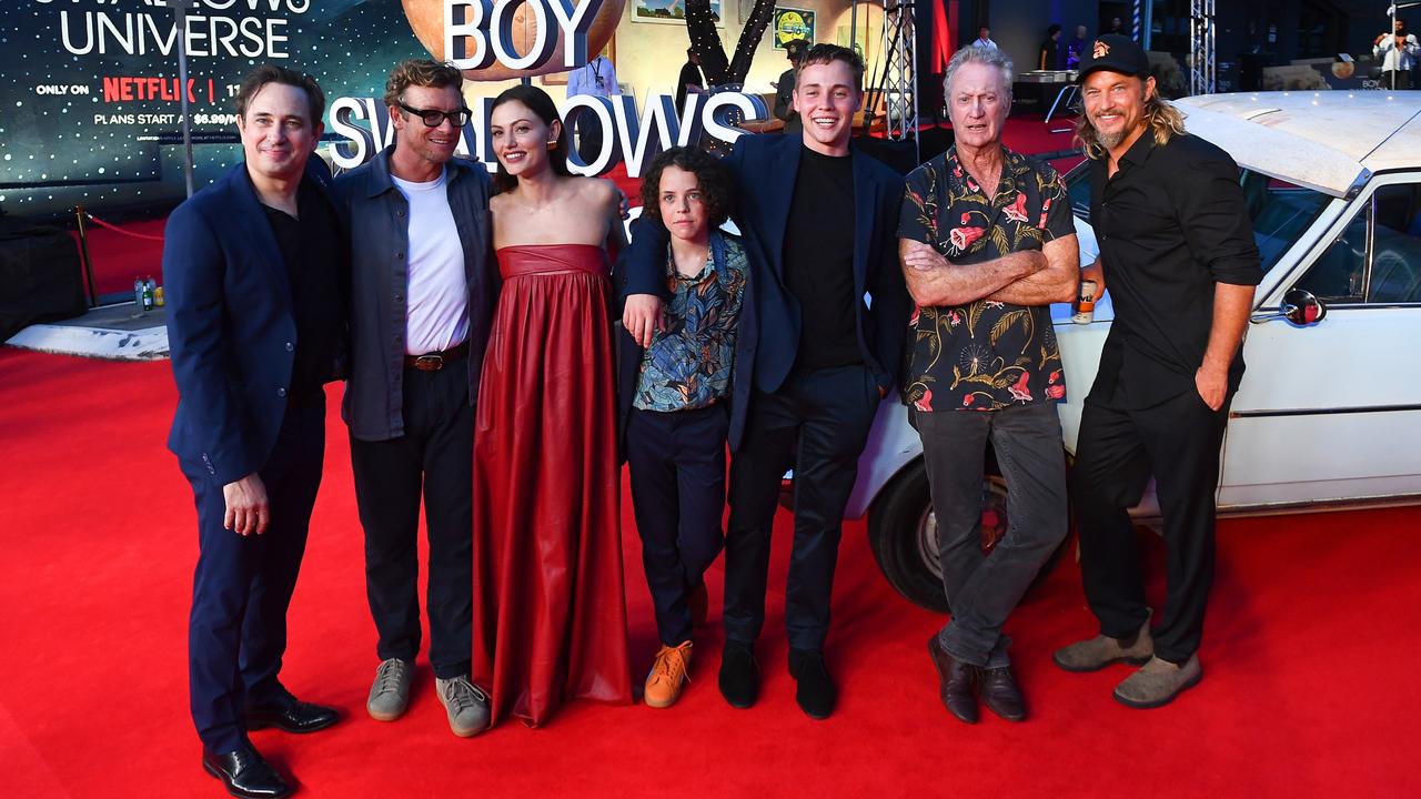 From left, Boy Swallows Universe author Trent Dalton with actors Simon Baker, Phoebe Tonkin, Felix Cameron, Lee Tiger Halley, Bryan Brown and Travis Fimmel at the Netflix global premiere of limited series Boy Swallows Universe at New Farm Cinemas in Brisbane on January 9 this year. Picture: Jono Searle/Getty Images for Netflix