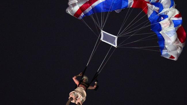 An actor dressed as Queen Elizabeth II parachutes into the stadium during the opening ceremony of the London 2012 Olympics. Picture: AFP/Olivier Morin