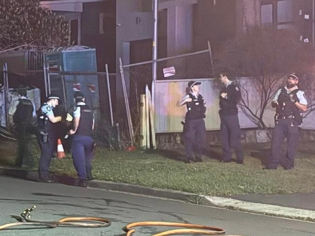 Officers from Parramatta Police Area Command set up a crime scene around the burnt-out vehicle in Northmead. Picture: Australian Incident Response Services Media