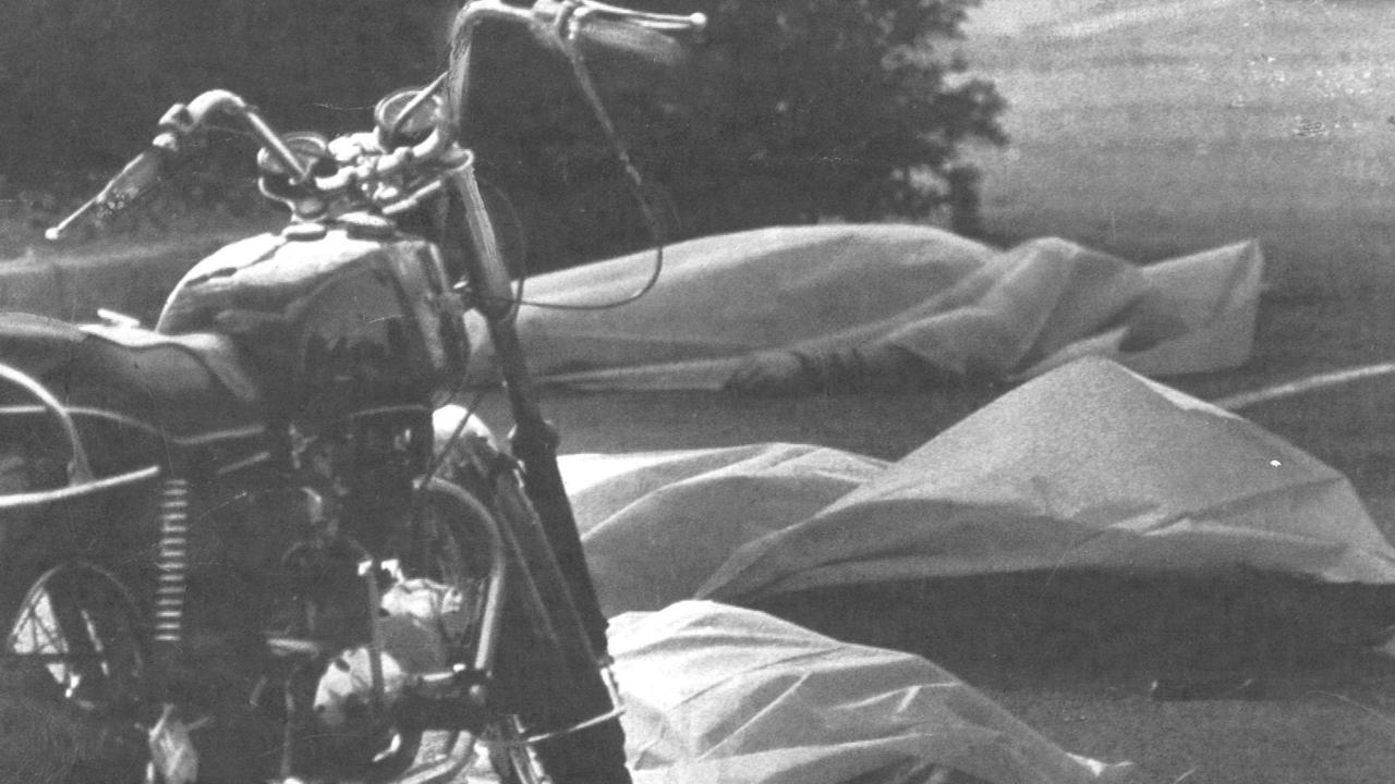 Three of the six dead bikies lay covered outside the Viking Tavern in the wake of the massacre.