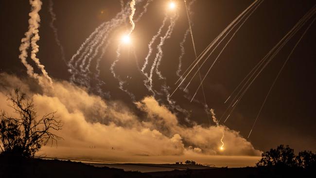 The sky over Gaza is lit up by missiles and flares. Picture: AFP