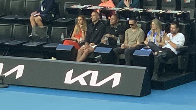 Toby Mitchell in the on-court seats next to Rebecca and Chris Judd.