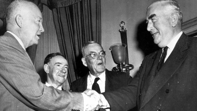 Dwight Eisenhower, left, greets Australian prime minister Robert Menzies at the White House in 1956. Between them are Australian ambassador Sir Percy Spender and US Secretary of State John Foster Dulles. Picture:, at the White House in Washington, DC, 14/09/1956. Picture: United Press