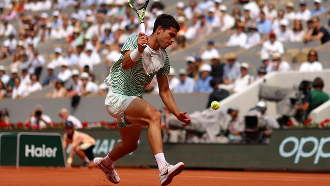 PARIS, FRANCE - JUNE 09: Carlos Alcaraz of Spain plays a forehand against Novak Djokovic of Serbia during the Men's Singles Semi Final match on Day Thirteen of the 2023 French Open at Roland Garros on June 09, 2023 in Paris, France. (Photo by Clive Brunskill/Getty Images)