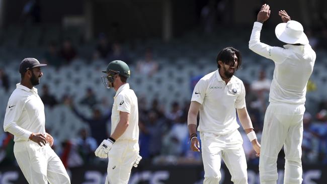 India's Ishant Sharma, second right, is jubilant after snaring the wicket of Travis Head. Picture: AP