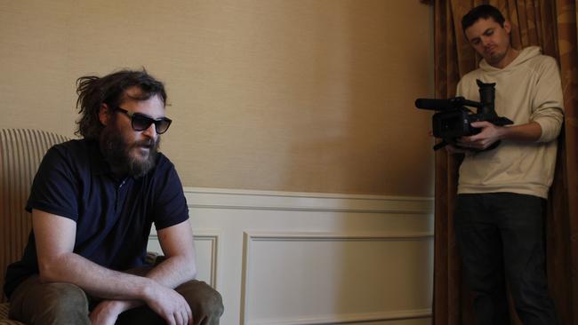 Casey Affleck filming actor Joaquin Phoenix for I’m Still Here. Picture: AP Photo