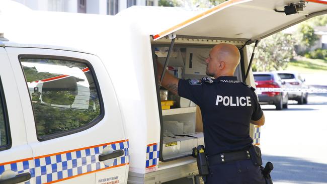 Police and Queensland Fire and Emergency Services investigate at a home in Coomera after emergency services were called to a house fire and a manÃ•s body was found inside. Picture: Tertius Pickard