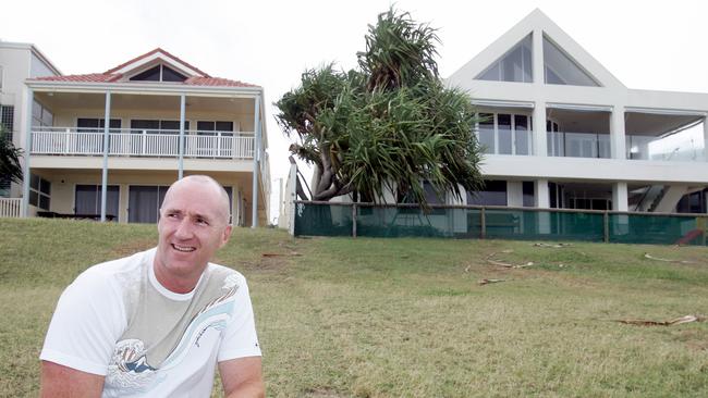 A 2005 photo of then BreakFree boss Tony Smith in front of his 39 Hedges Ave beachfront property (R) and the adjoining house No. 37 which he purchased off Jim Gardiner for $7 million. Pic: Adam Head