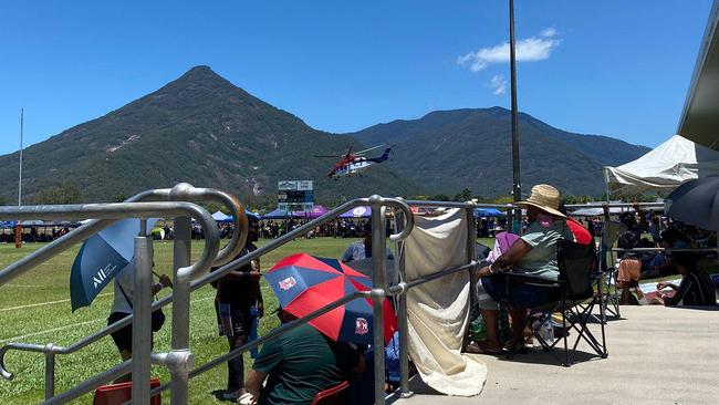 The Rescue 510 helicopter arrives at the Gordonvale Indigenous Rugby League Carnival to treat Yarrabah man Thaddeaus (Thaddo) Johnson. Picture: Supplied