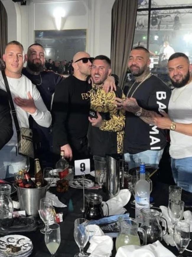 Mohamad Alameddine, far right, on a night out with Tarek Zahed, seen kissing new Comanchero national president Allan Meehan. Picture: Instagram