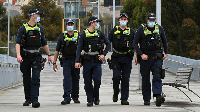 Police patrol the quiet streets of Melbourne, which has been locked down for 246 days. Picture: AFP