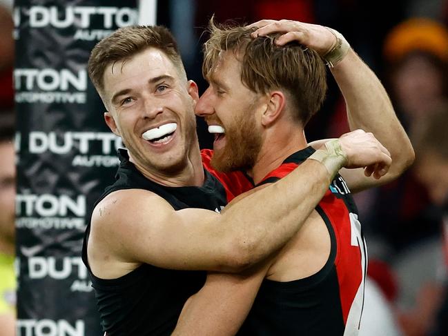 MELBOURNE, AUSTRALIA - JUNE 23: Zach Merrett (left) and Dyson Heppell of the Bombers celebrate during the 2024 AFL Round 15 match between the Essendon Bombers and the West Coast Eagles at Marvel Stadium on June 23, 2024 in Melbourne, Australia. (Photo by Michael Willson/AFL Photos via Getty Images)