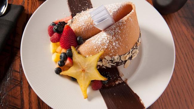 The giant fortune cookie of white and dark chocolate mousse is Tao’s signature dish.