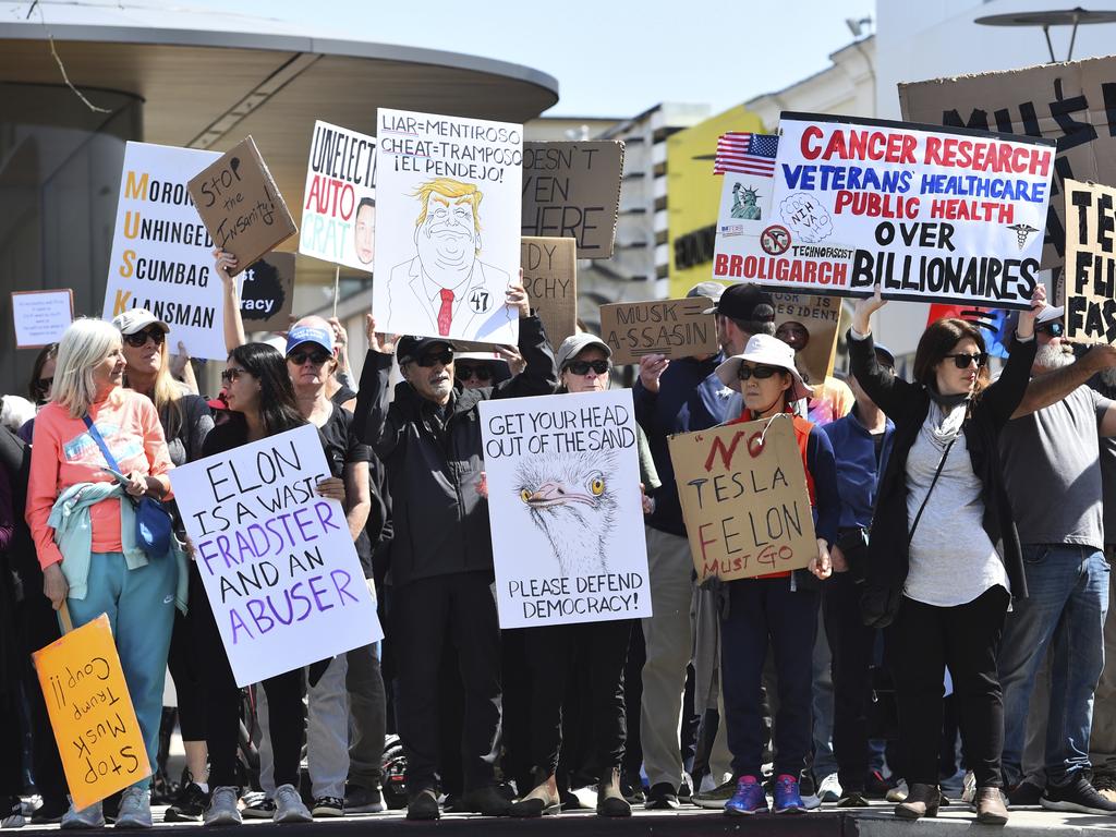 Protesters hold signs in Walnut Creek, California, during a demonstration against Elon Musk. Picture: AP
