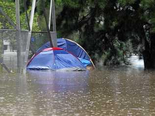 There are no photos of Damian Bathersby's new tent in the Gympie storm so here's a file photo of someone else's predicament after a different storm, somewhere else. Picture: John Gass /TWE250112wet