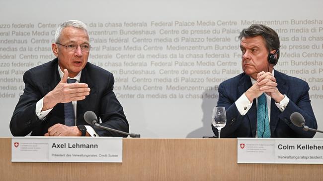 Credit Suisse chairman Axel Lehmann (L) next to UBS Chairman Colm Kelleher as they attend a press conference after talks over UBS taking over its rival Swiss bank Credit Suisse in Bern.