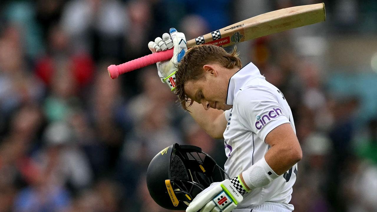 England's Ollie Pope celebrates his century. Photo by Glyn KIRK / AFP