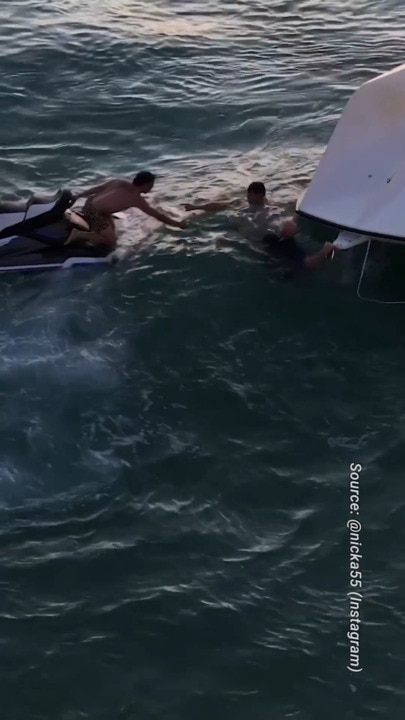 Footage shows boat capsize and rescue off North Stradbroke Island