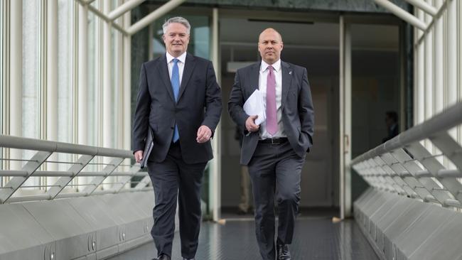 Treasurer Josh Frydenberg and Finance Minister, Mathias Cormann on their way to release the Federal Budget 2020-2021 at Parliament House. Picture: NCA NewsWire / Martin Ollman