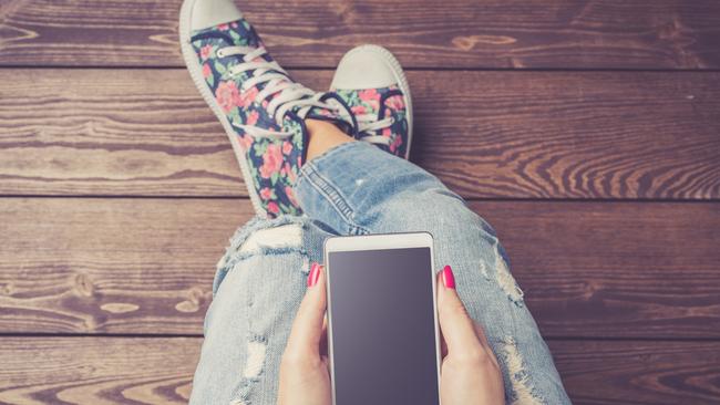 Generic photo of girl with a phone, for SA Weekend column by Mark Dapin. Picture: iStock