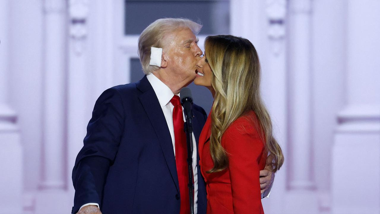 Donald Trump kisses former first lady Melania Trump after officially accepting the Republican presidential nomination on stage. Picture: Getty