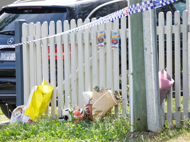 Tributes laid on Wednesday at the fence of a home where the boys lived in Faulconbridge. Picture: Max Mason-Hubers