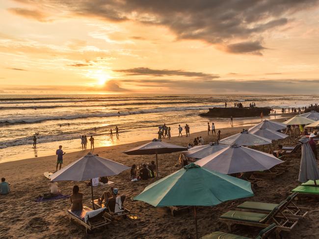 Bali, Indonesia - February 18, 2017: People enjoy the sunset over Canggu beach, north of Kuta and Seminyak, in Bali in Indonesia. Canggu is popular with surfers and expats. Picture: iStock