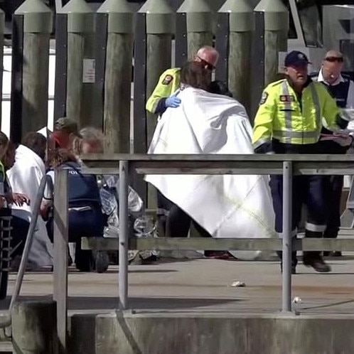 Paramedics treat injured people at the scene yesterday. Picture: Reuters