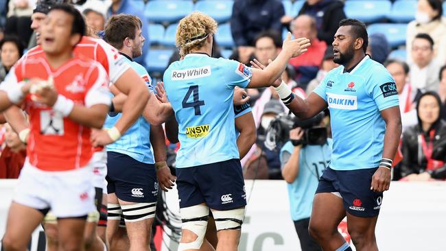 The Waratahs celebrate Naiyaravoro’s (right) try.