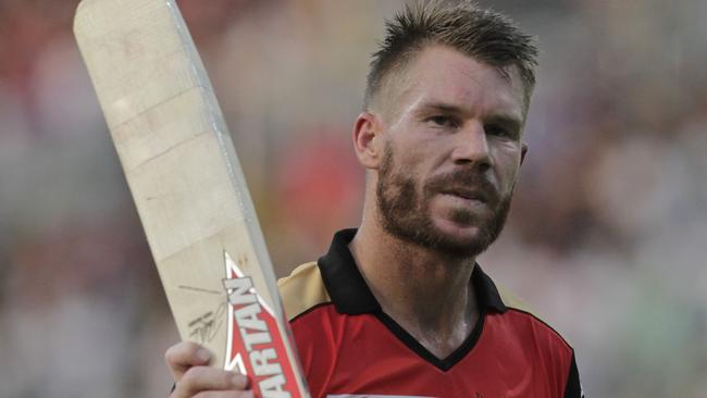 David Warner acknowledges the crowd as he walks back to pavilion after his dismissal during his IPL cricket T20 match.