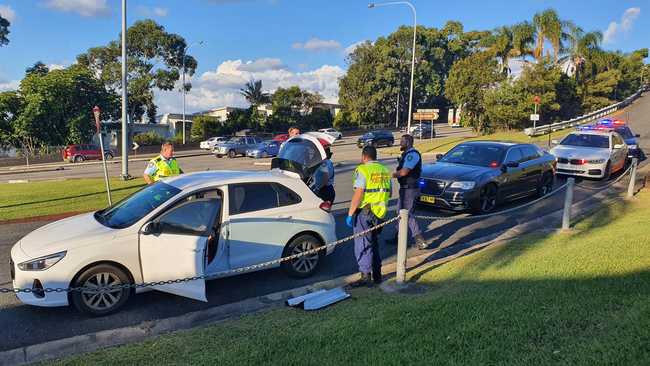 Officers from Coffs/Clarence Traffic and Highway Patrol following an alleged high speed pursuit which started at Glenugie and ended near the Big Banana at Coffs Harbour. Photo: Frank Redward