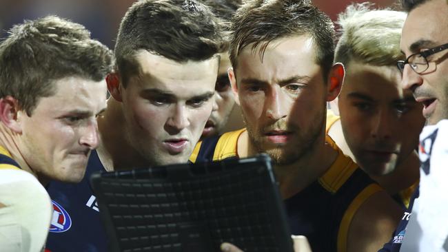 Matt and Brad Crouch look on at an Adelaide huddle. Picture: Sarah Reed