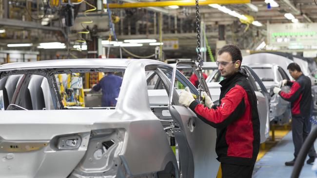 Workers assemble cars on the Altona production line. Pic: Supplied.