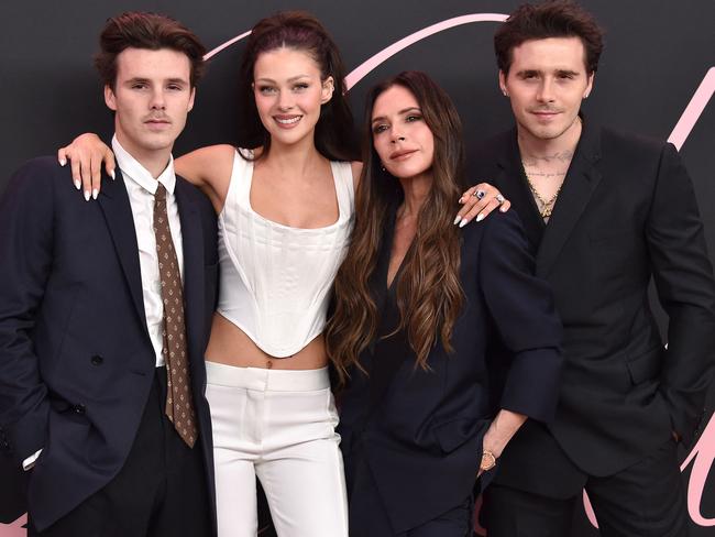 The Beckham brood! Victoria, second from right, with her son Cruz (far left), daughter-in-law Nicola Peltz Beckham, and eldest son, Brooklyn Beckham (far right). Picture: AFP