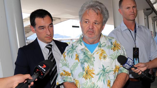 Peter Foster being police escorted through Cairns airport on route to Sydney. Picture: Stewart McLean