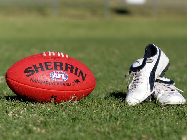 Generic AFL Sherrin football and football boots. sport /