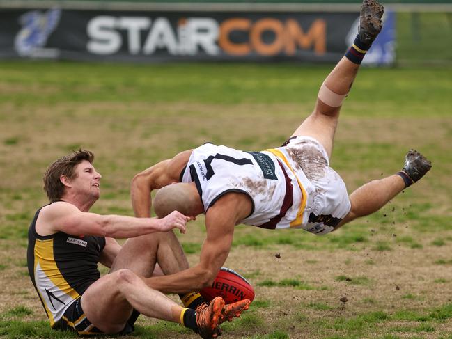 EFL: Jarryd Lowther of Doncaster East is chased down by Balwyn’s Charlie Haley. Photo: Hamish Blair