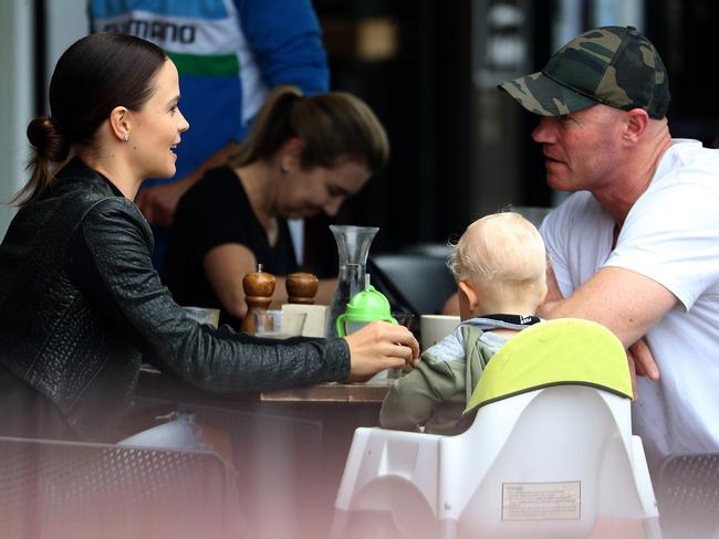 Barry Hall with his partner Lauren Brant and their son Miller having breakfast on the Gold Coast.