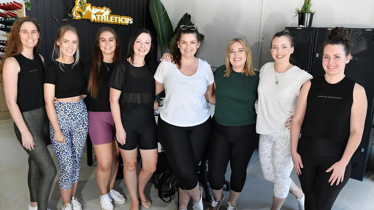 Empress Athleticus owners Brittany Lewin and Kristy Perdriau (centre) have started up a new activewear clothing line being made on the Coast. Picture: Patrick Woods