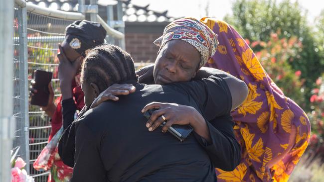 Mourners visit the scene. Picture: Sarah Matray