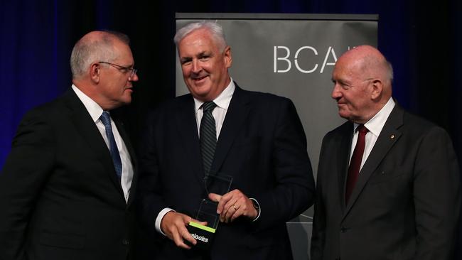 Pat Creaghan, centre, accepts the Big Impact Award on behalf of ATCO at the Business Council of Australia 2021 Biggies Award with Prime Minister Scott Morrison and Sir Peter Cosgrove in Sydney on Monday night. Picture: Jane Dempster