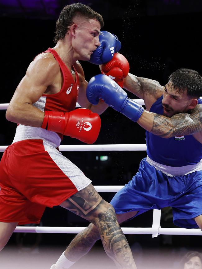 Harry Garside punched by Richard Kovacs of Hungary. Pic: Michael Klein.